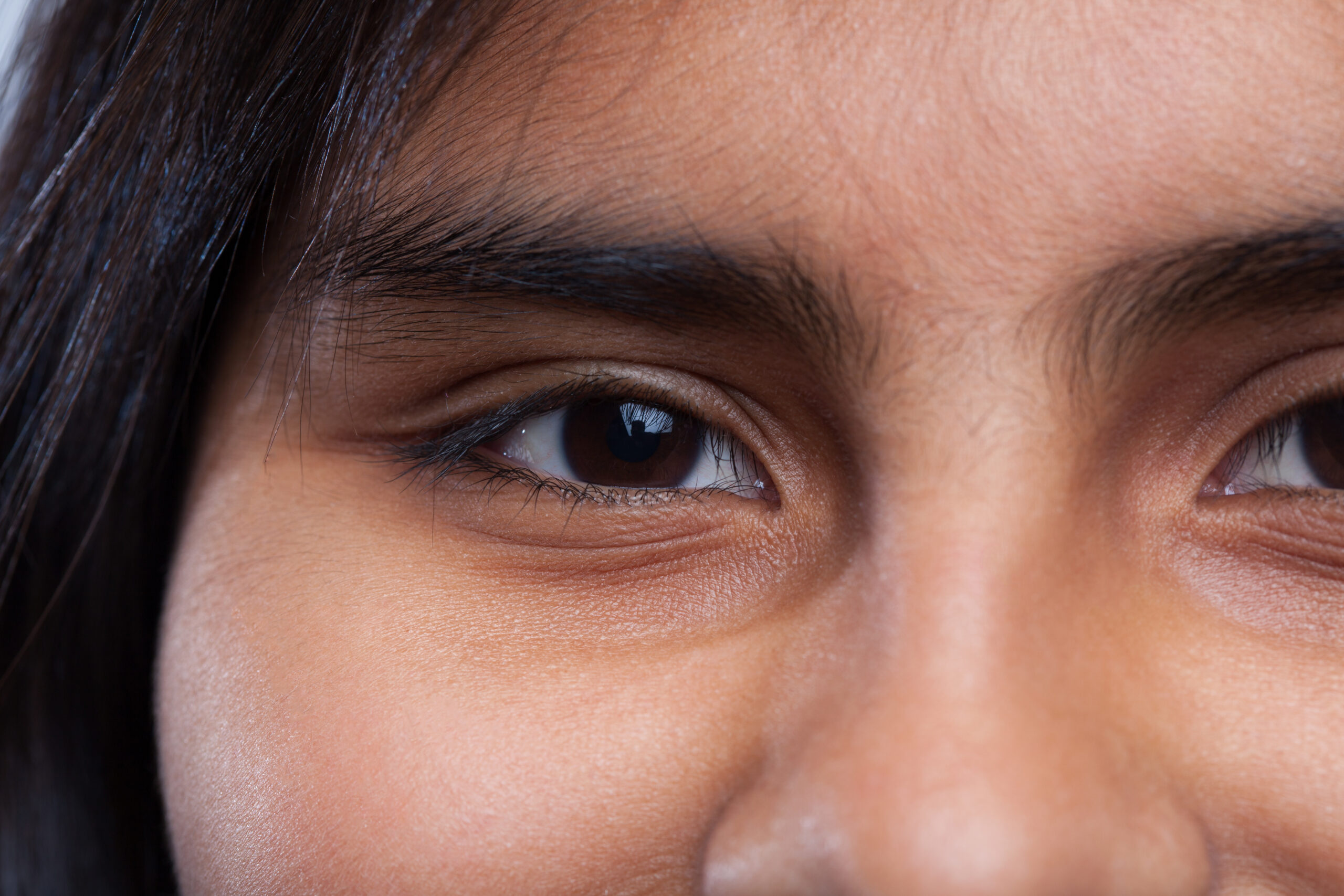 Happy latin girl eyes closeup